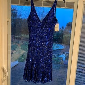 Size 8 -runs a 4- brand new sequined dress